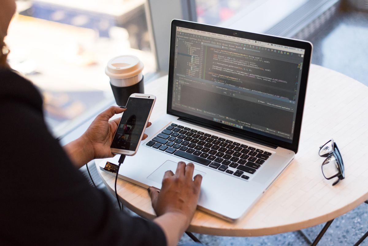 Developer building business software across multiple monitors
