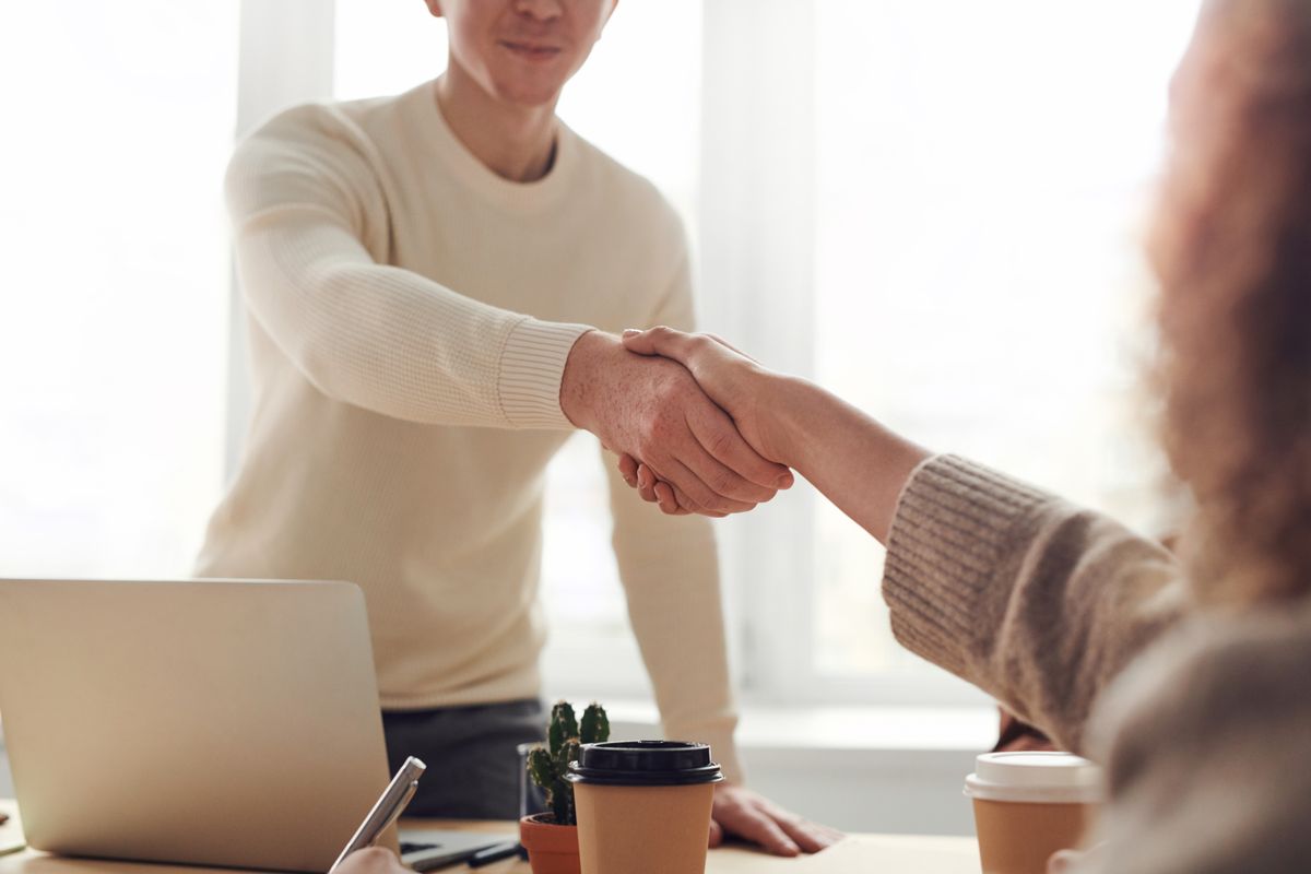 Corporate team collaborating around a table in a modern office